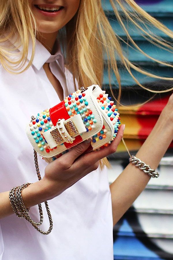 Mini Christian Louboutin clutch with multicolored spikes? Count us in.