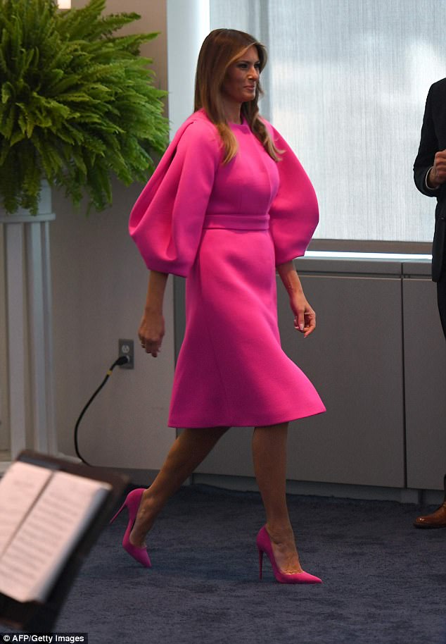Melania  paired her bright ensemble with matching hot pink pumps 