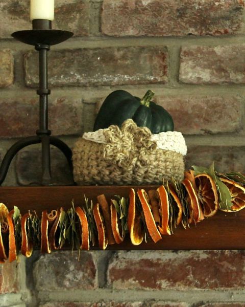 Dried orange slices, balanced by bay leaves and cinnamon sticks, look lovely strung up on a mantel — but smell sweeter than a fabric banner or glittering garland. Get the tutorial at Garden Matter » 