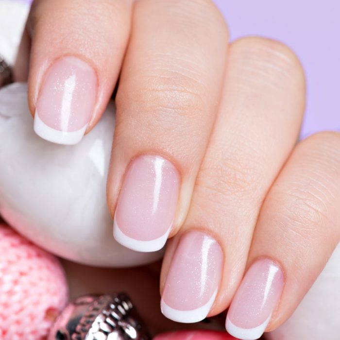 beautiful woman s nails with beautiful french white manicure scaled e1706670667407
